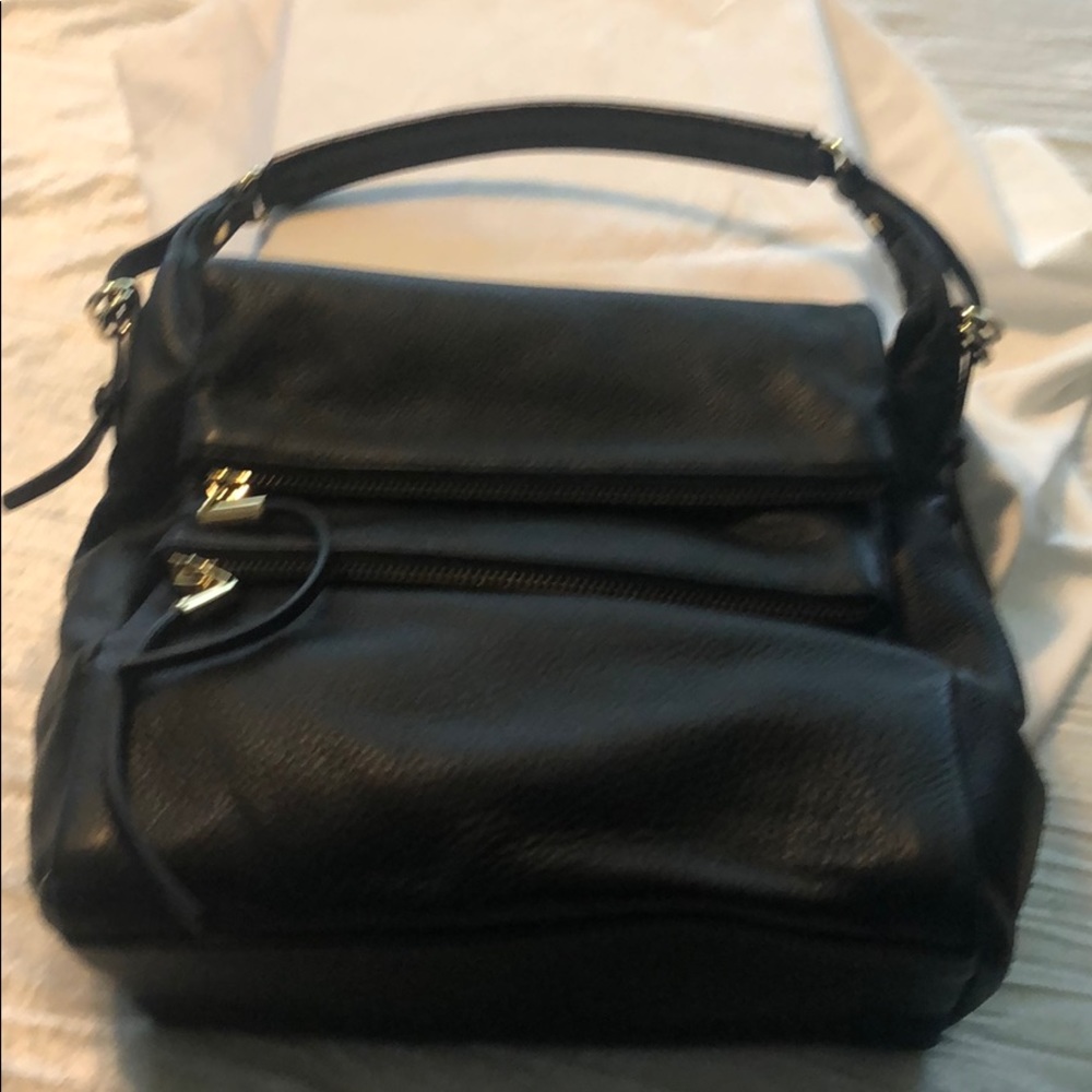 Vince Camuto black leather handbag.